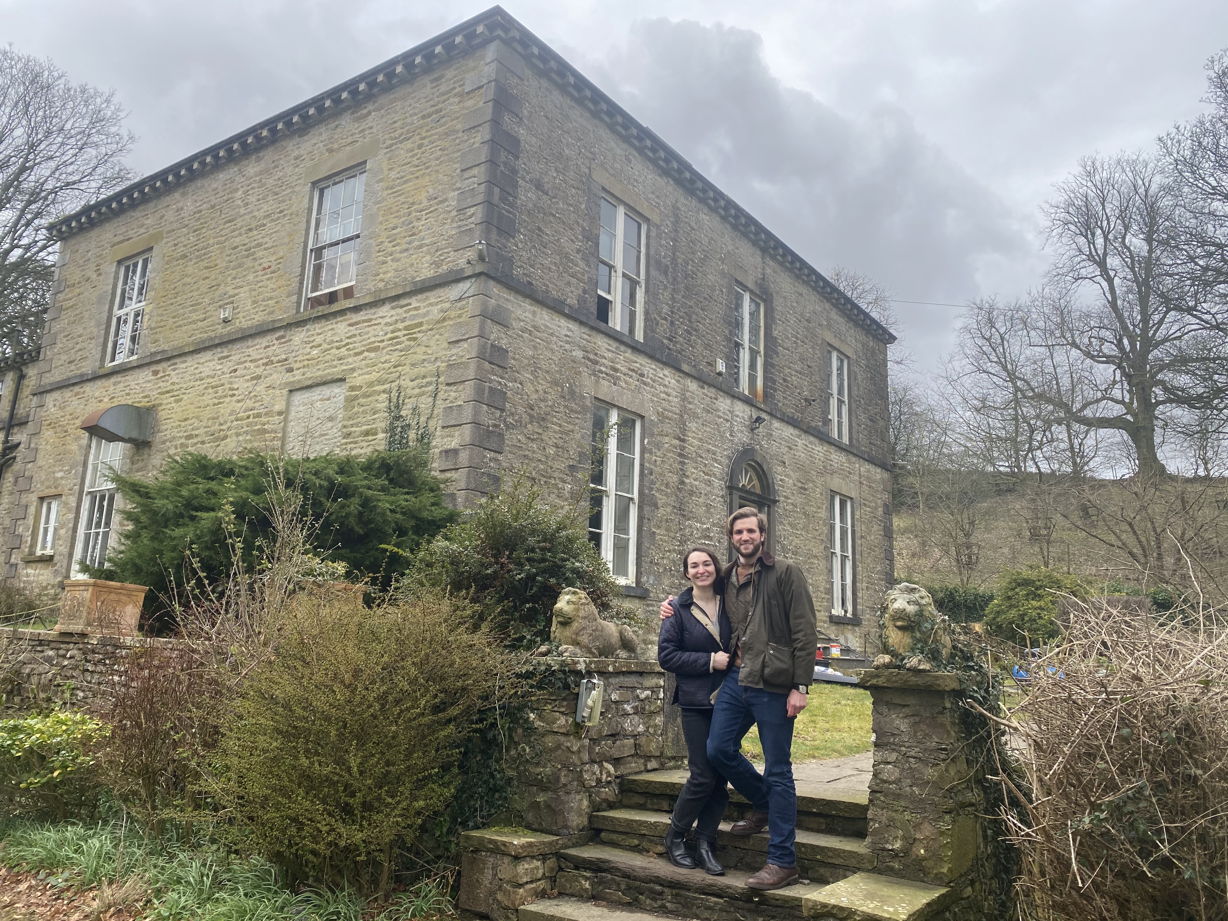 Hugh and partner outside their listed building